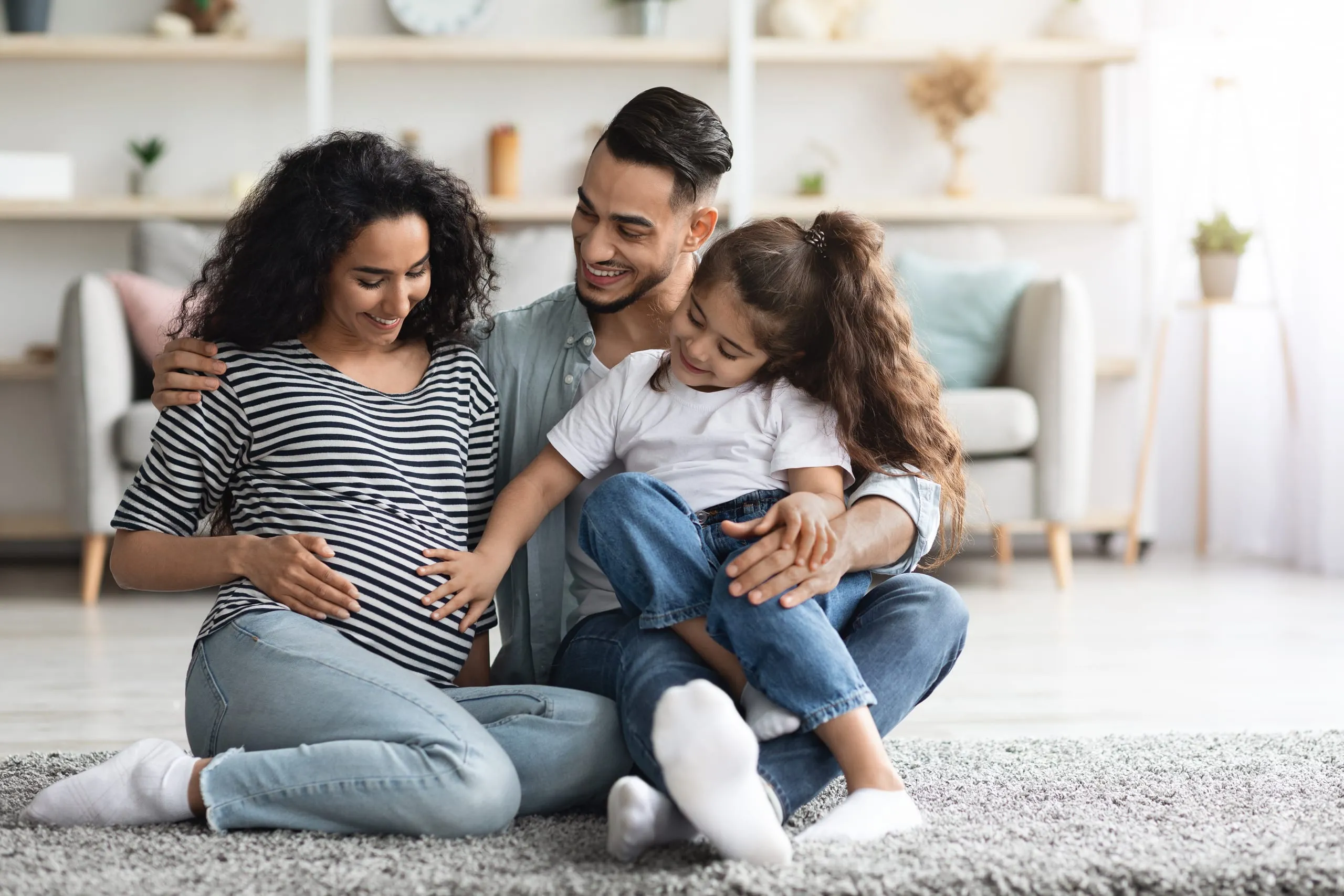A family at home awaiting the arrival of a new baby